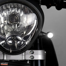 Bullet Front 2 in 1 LED Turn Signals Are Mounted on Vintage Motorcycle, Emitting White Running Light.