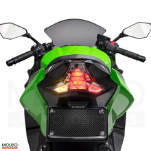 Kawasaki Ninja 400 / Z400 integrated tail light, with turn and brake light on, sends a bold signal, combining turning cues and an urgent stop alert.