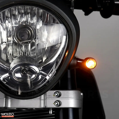 MOLEO Motosports Bullet Style Front LED Indicators are installed on the cafe racer vintage motorcycle.